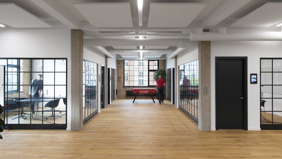 Rockfon Eclipse® Islands installed in the open plan office space of IIH Nordic, Copenhagen, Denmark