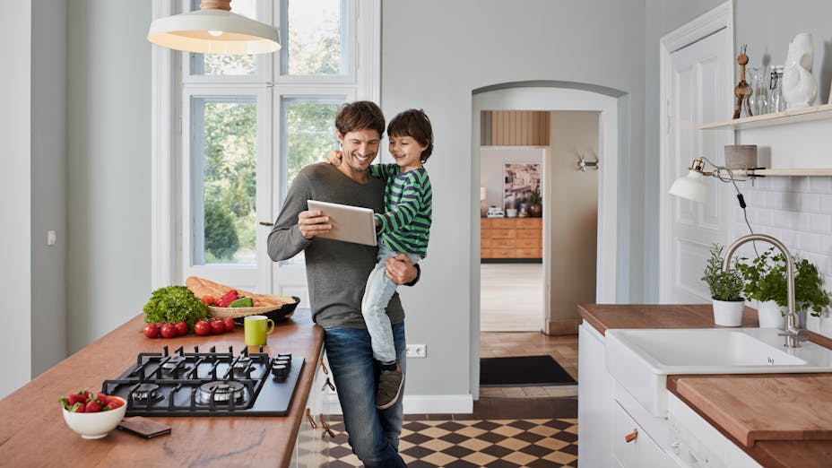 Man and son looking at ways to save energy