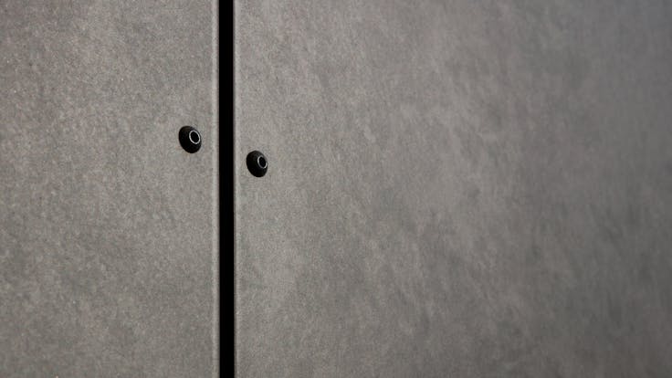 Sports hall 'Lärkan' in Sala, Sweden cladded with Rockpanel Stones Mineral Rust and Basalt Iron facade cladding.