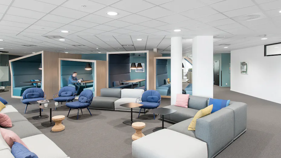 Rockfon Sonar acoustic ceiling tiles installed with Chicago Metallic suspension system in open office environment.