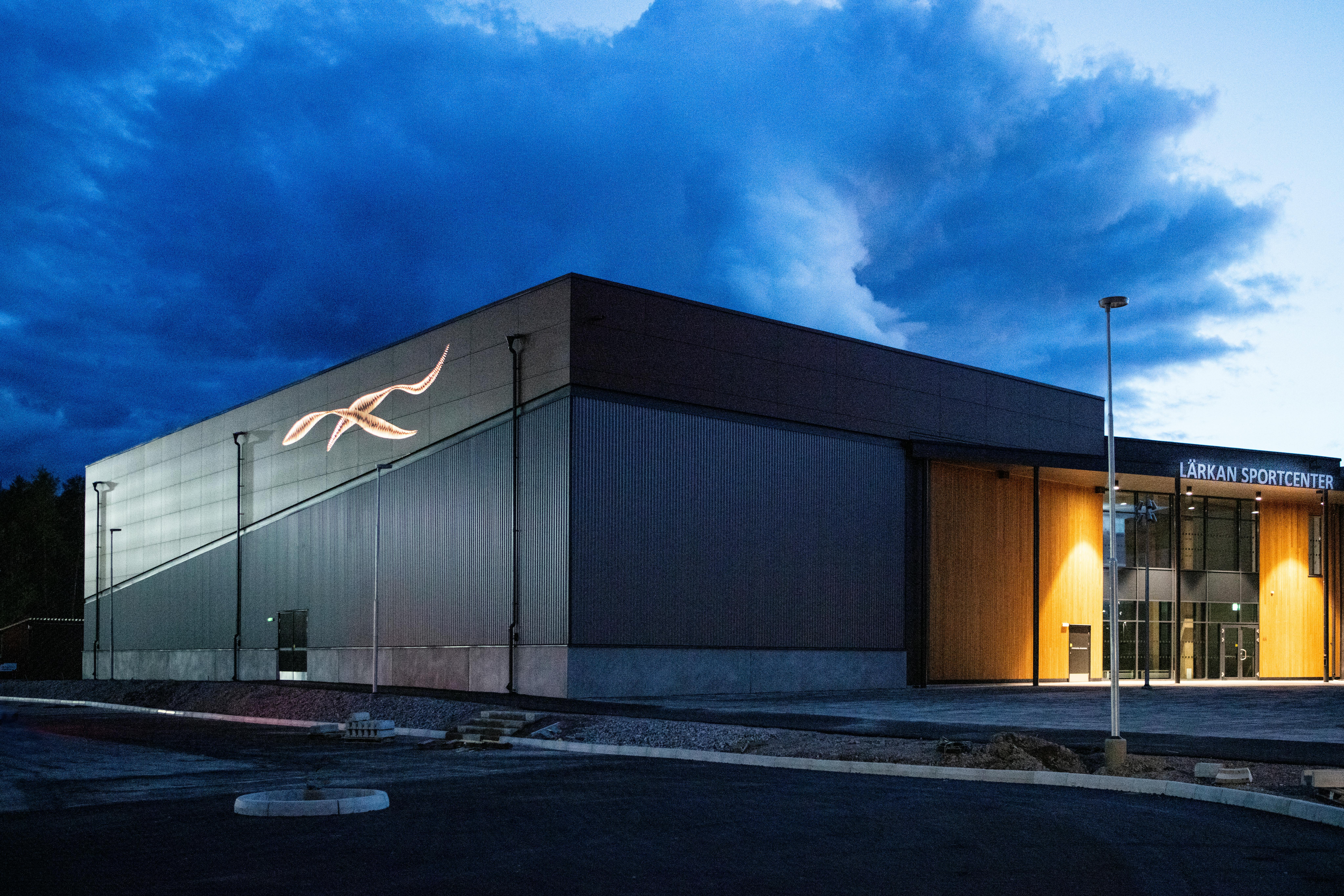 Sports hall 'Lärkan' in Sala, Sweden cladded with Rockpanel Stones Mineral Rust and Basalt Iron facade cladding.