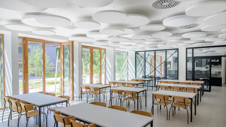 Canteen in COPaG high school in Prague Czech Republic with Rockfon Eclipse A-Edge