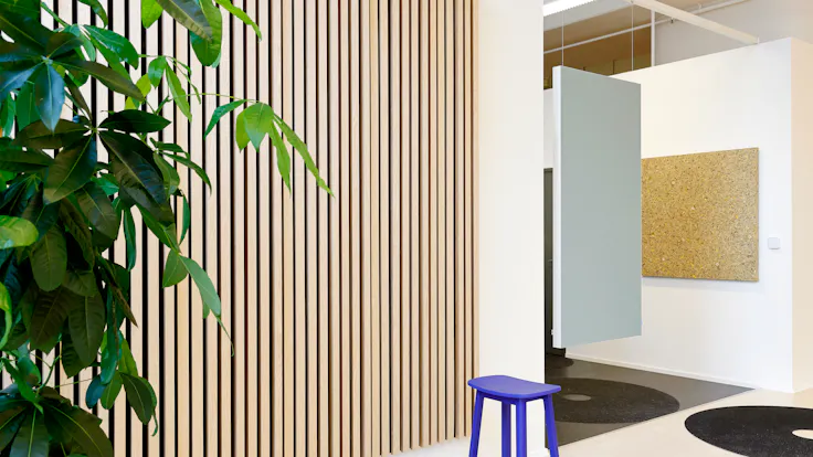 Corridor in INR Iconic Nordic Rooms in Espoo Finland with Rockfon Canva Hanging Divider and Rockfon Lamella and Rockfon Senses