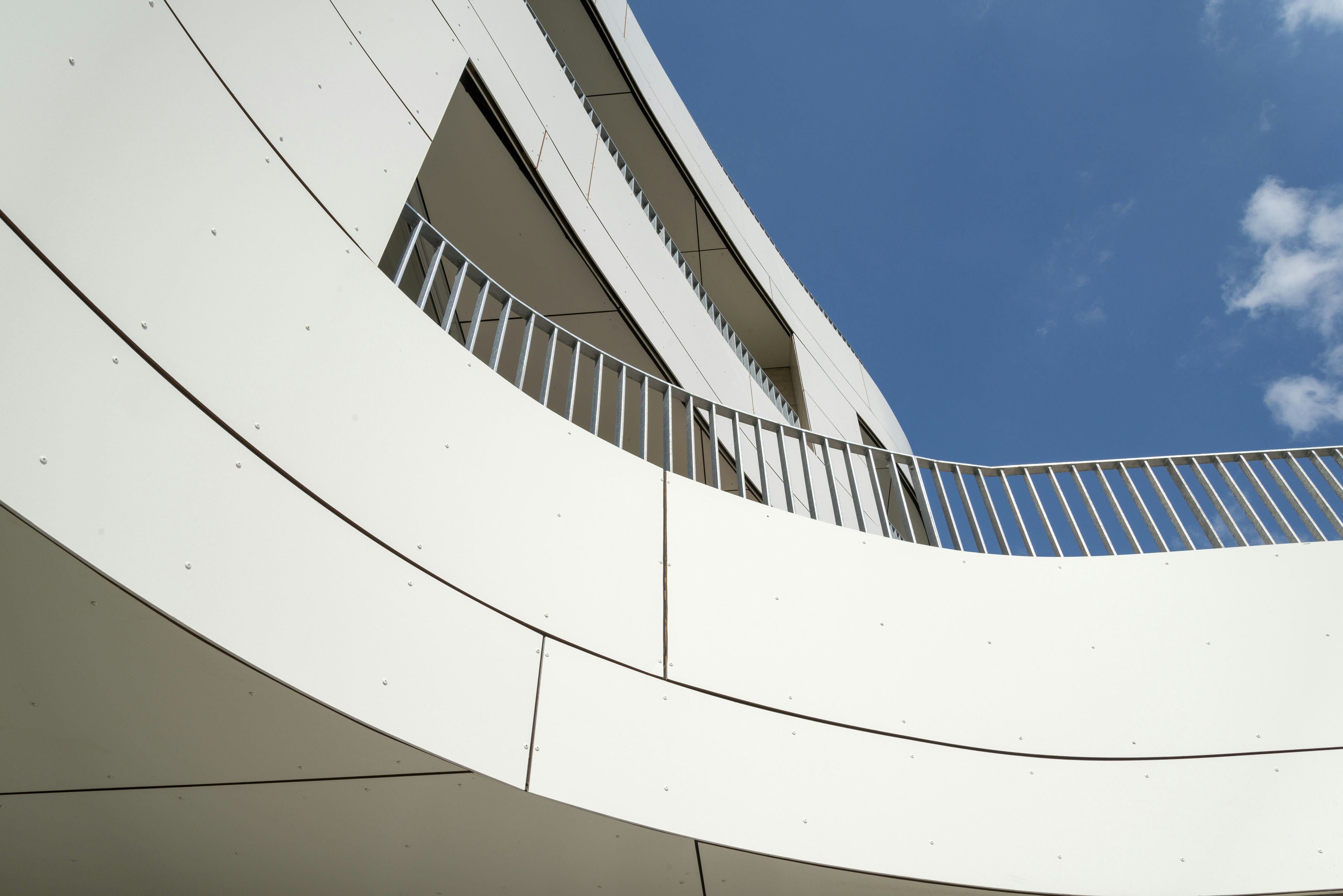 Multi Family housing in Ypres, Belgium cladded with Rockpanel Colours and curved.