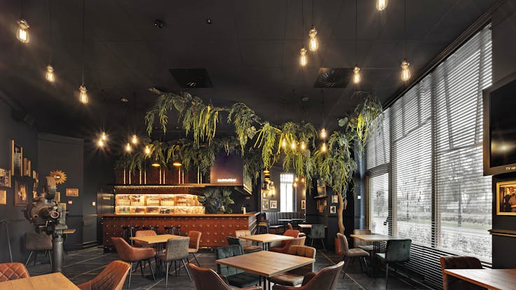 Restaurant of Plopsa hotel in De Panne Belgium with Rockfon Color-all Charcoal in D-edge