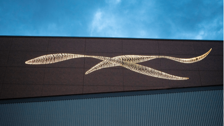 Sports hall 'Lärkan' in Sala, Sweden cladded with Rockpanel Stones Mineral Rust and Basalt Iron facade cladding.