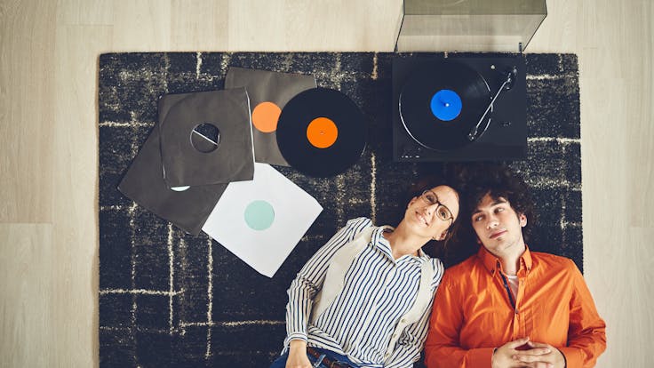 people on the floor - record player