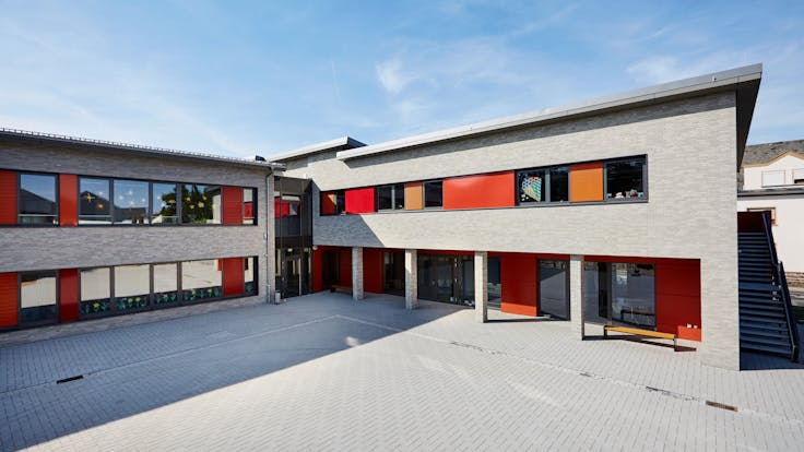 The Christophorus school in Mülheim-Kärlich (Germany) with (engraved) Rockpanel Metallics and Rockpanel Colours exterior cladding boards