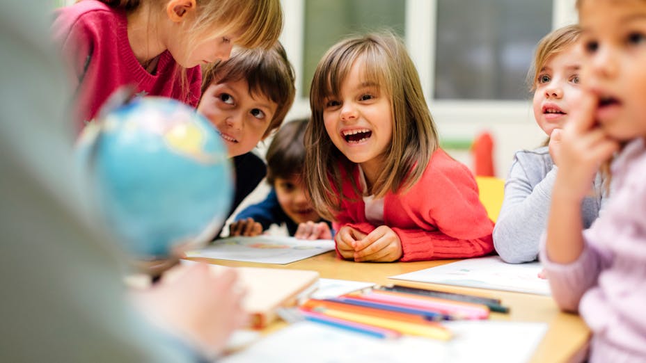 children in classroom with acoustic ceilings