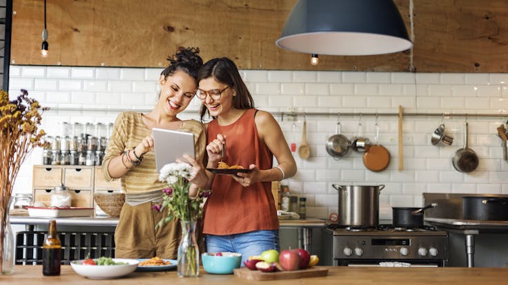 Female friends cooking. People.