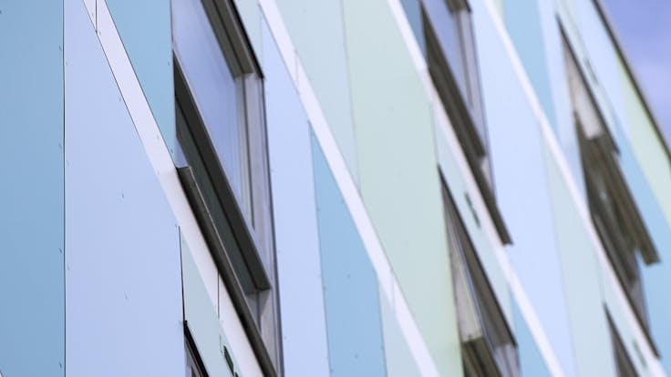 Eyot House (Multi Family House) in Bermondsey, London, United Kingdom cladded with A2 (FS-Xtra) in seven RAL colours plus Metallics Graphite Grey and Woods Cherry facade cladding.