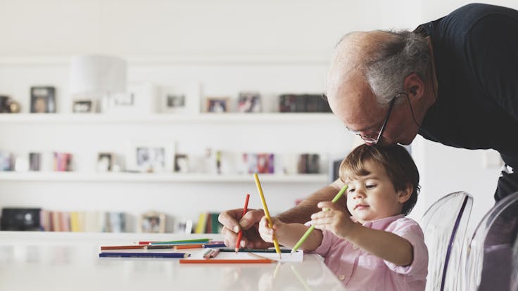 People indoor living room Grandfather help his child with drawing. Home, indoor, learning, people, improving people's lives, children, crayons, learning