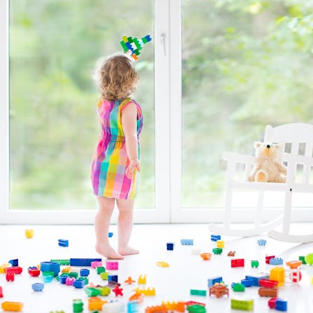Child playing with blocks indoor