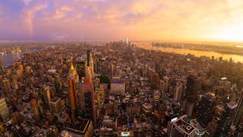 New York City skyline with Manhattan skyscrapers at dramatic stormy sunset, USA.