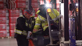 People working together, doing their jobs, teamwork, plant operations at the production manufacturing factory facility in Milton, ON