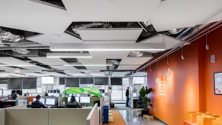 Rockfon Alaska and Island ceiling tiles and panels installed with Chicago Metallic 1200 suspension system in Solar Spectrum Office.