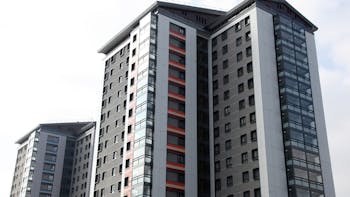 Refurbishment three high-rise residential towers, The Crofts in Birmingham, United Kingdom with Rockpanel Colours in FS-Xtra grade. Renovation. A2 fire rated boards
