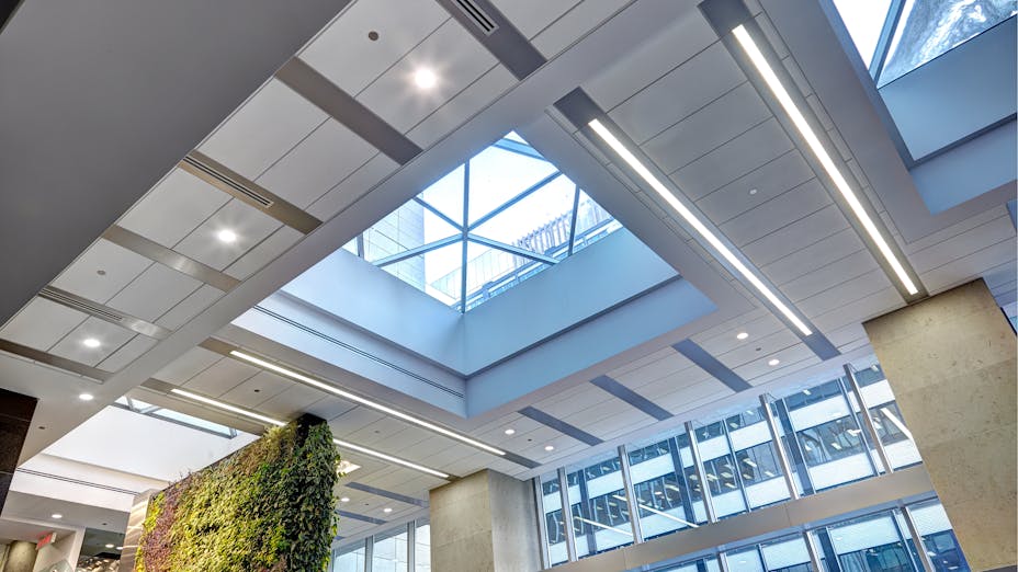 Rockfon Planar MacroPlus linear metal ceilings installed in office building for LEED certification.