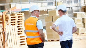 construction site, communication, two men, talking, stone wool, pallet, germany