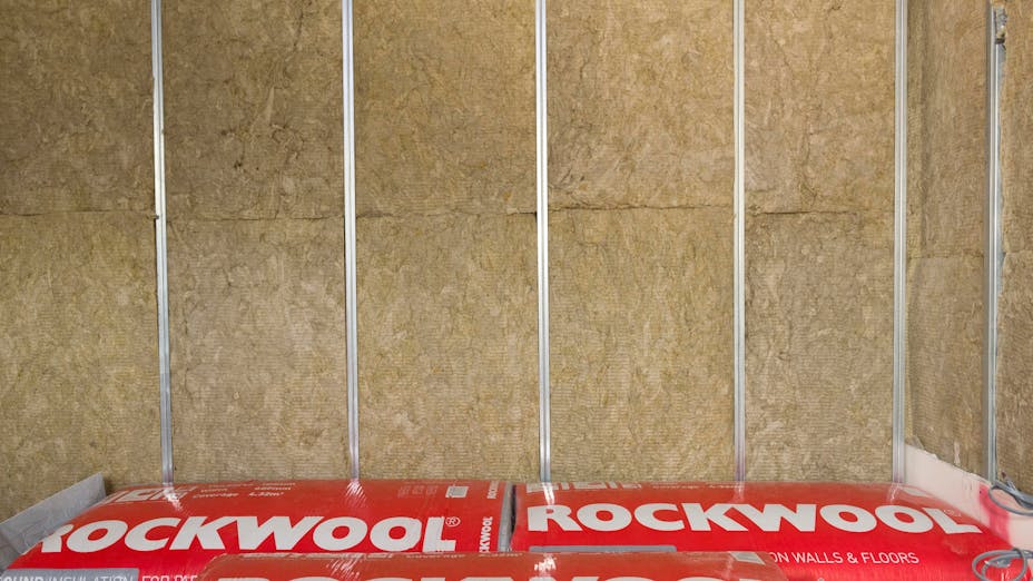 Utility Wise project - Installer carrying ROCKWOOL insulation on shoulder