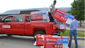 ROCKWOOL bags on truck getting offloaded in Grand Forks