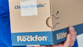 Rockfon Grid Box being held - Camera angle on the end of the box