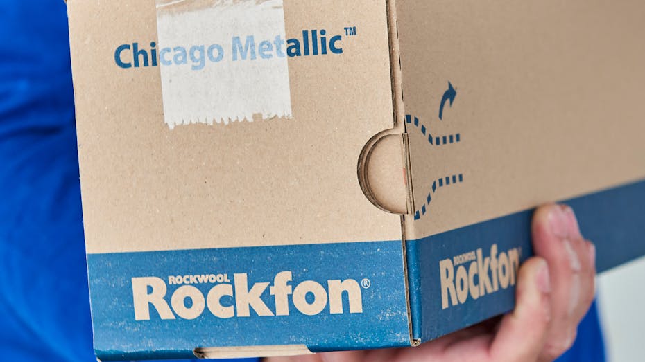 Rockfon Grid Box being held - Camera angle on the end of the box