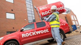 Utility Wise project - Installer carrying ROCKWOOL insulation on shoulder