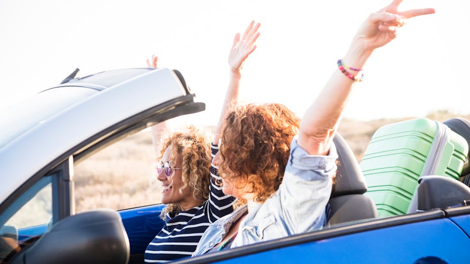 Couple adult women in convertible