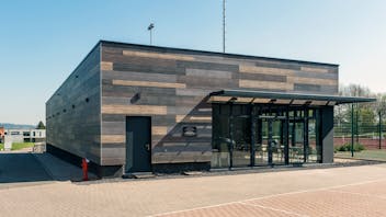Sale de Sports in Celles, Belgium cladded with Rockpanel Woods facade cladding