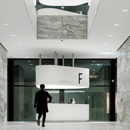 Reception area of Nieuwe Rechtbank in Amsterdam The Netherlands with Rockfon Mono Acoustic