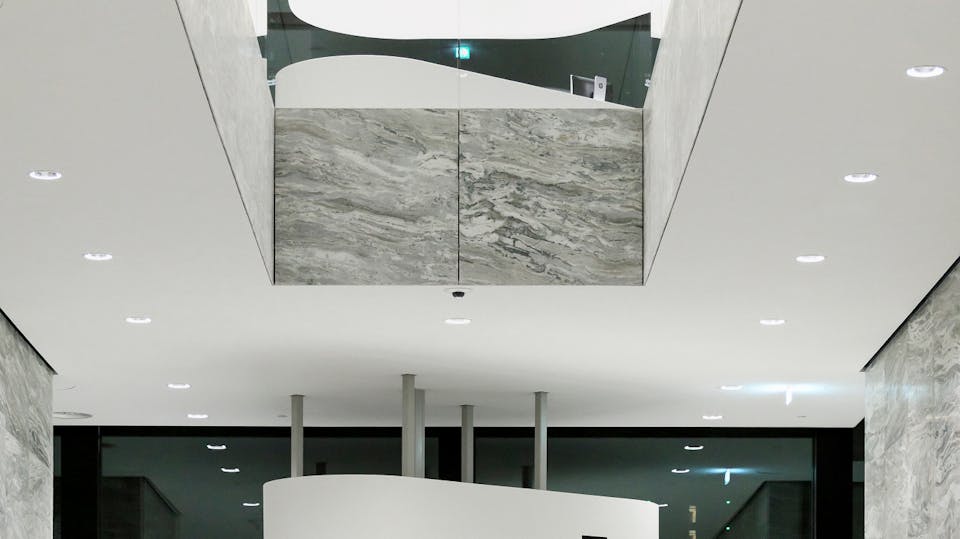 Lights and other services are integrated into the ceiling for a seamless appearance