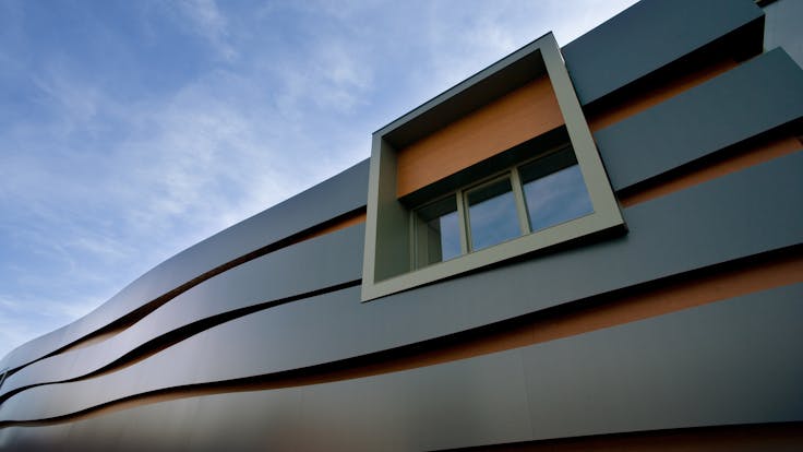 Facade of Rockpanel Office/Factory building in Roermond, The Netherlands. Cladded with Rockpanel Metallics/Rockpanel Woods