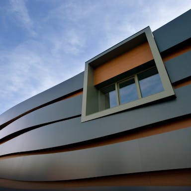Facade of Rockpanel Office/Factory building in Roermond, The Netherlands. Cladded with Rockpanel Metallics/Rockpanel Woods