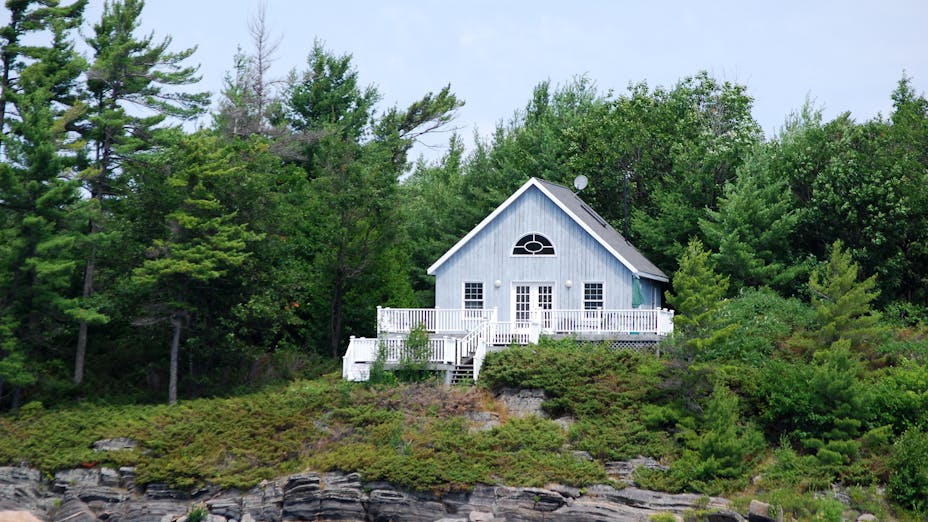 A cottage on a rocky shore