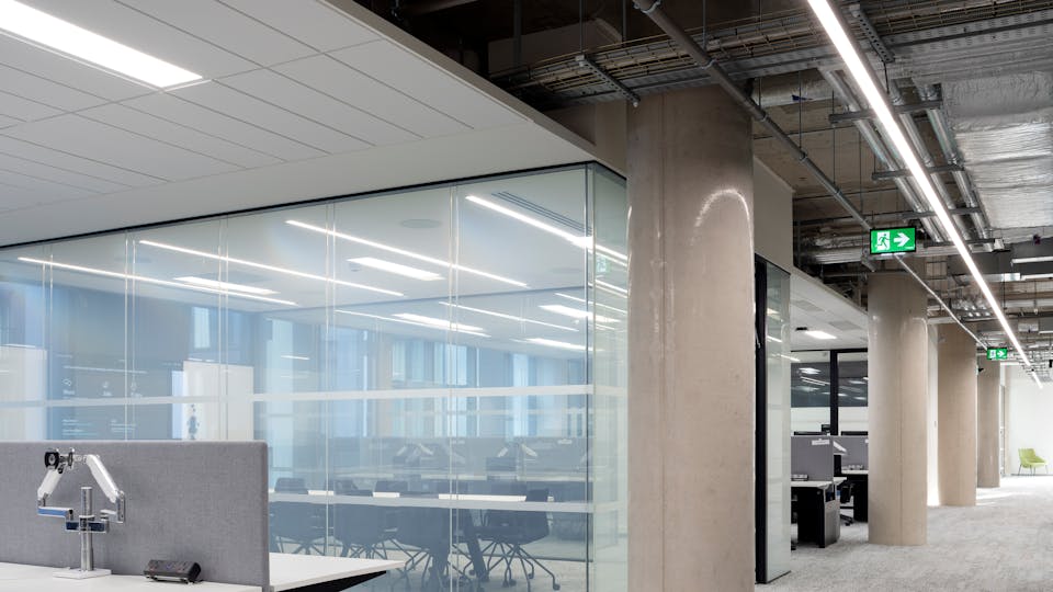 Glazed meeting room has an acoustic ceiling to prevent sound reverberation