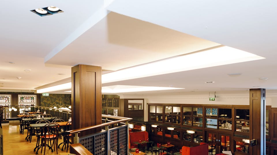 Seamless acoustic ceiling with integrated lighting