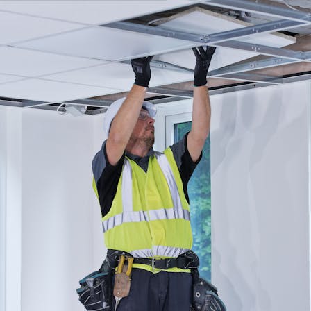Suspended ceiling installer in the UK installing Rockfon Tropic A Edge. Installer, installing, ceiling, tiles