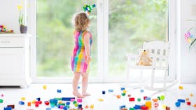 Child playing with plastic bricks