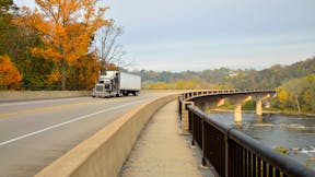 Tractor Trailer Crossing Shenandoah River in West Virginia supporting local business and supplier partners. Ranson, Jefferson County, WV. Truck, transportation, freight services.