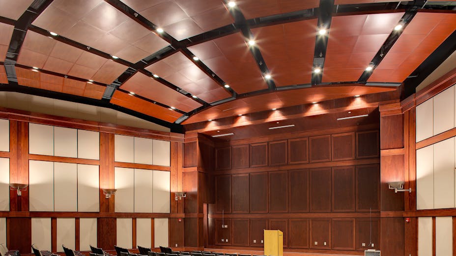 Dannelly Composite Operations and Training Facility's Auditorium, Alabama Army and National Air Guard, Seay-Seay & Litchfield Architects, Bear Brothers, Inc., E&E Acoustical and Drywall, Inc., SpanAir Torsion Spring Panels, Infinity Perimeter Trim, Custom WoodScenes, Walnut Painted Finish, Government, Curt Ullery