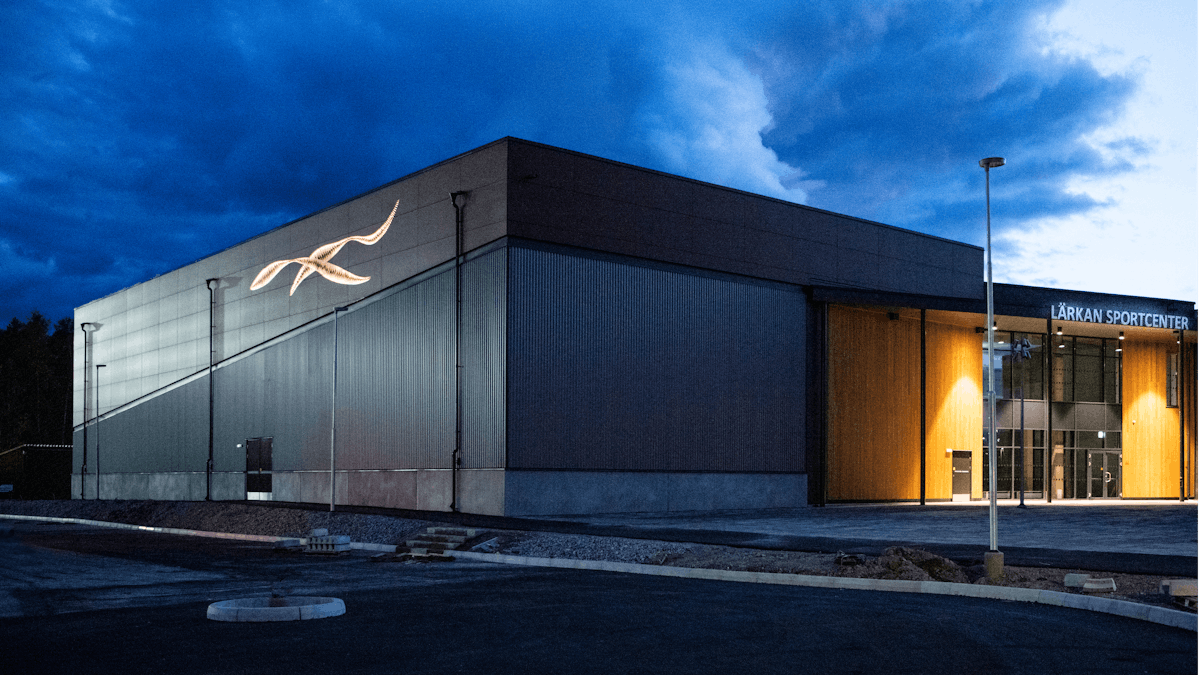 Sports hall 'Lärkan' in Sala, Sweden cladded with Rockpanel Stones Mineral Rust and Basalt Iron facade cladding.
