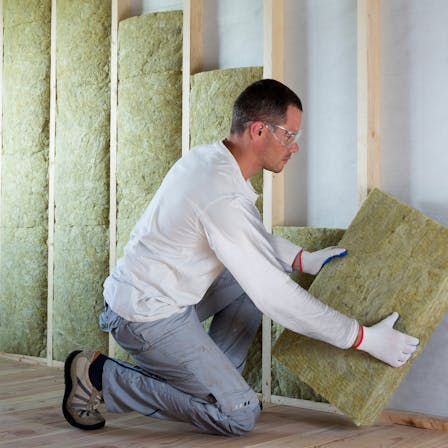 Man installing insulation, Self-builder, Renovation, Timber Frame Wall