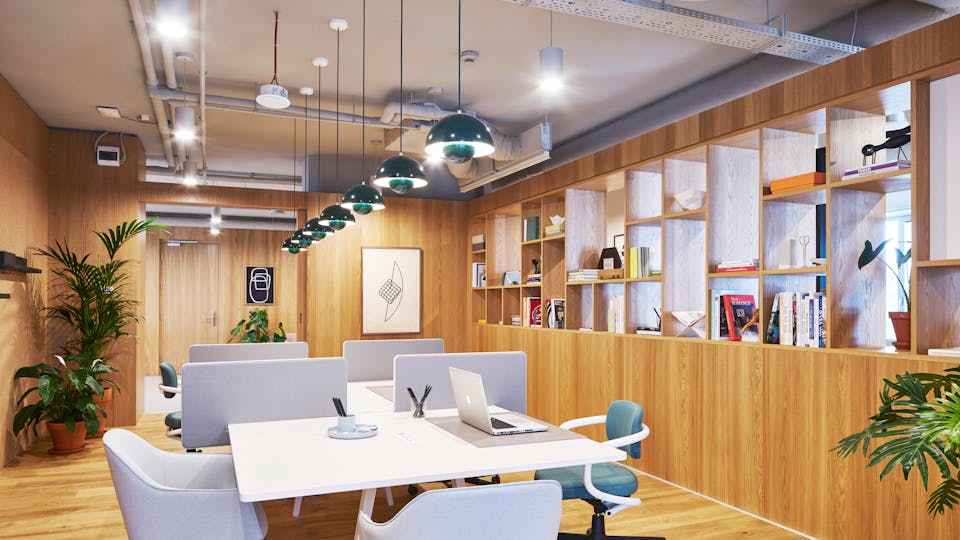 Shared office space, pale grey ceiling with built-in acoustic absorption
