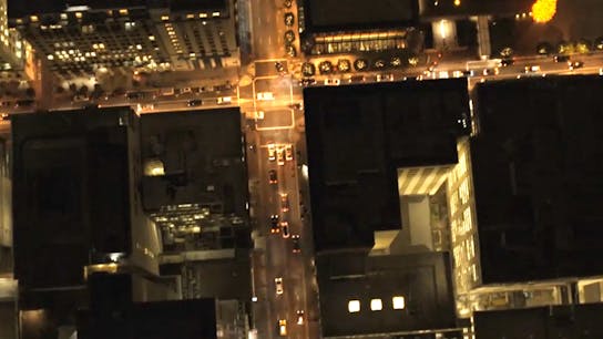 Multifix-Rooftop-Image (1), helicopter view, city, night, street lights, buildings, high rise