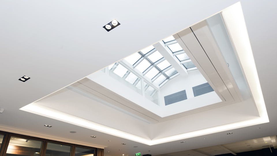 Refurbished period listed building has a new acoustic ceiling which harmonises with original features