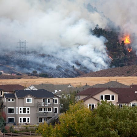 Colorado wild fire burns behind homes stock photo - wildfires and forest fires - wildland urban interface (WUI) zones