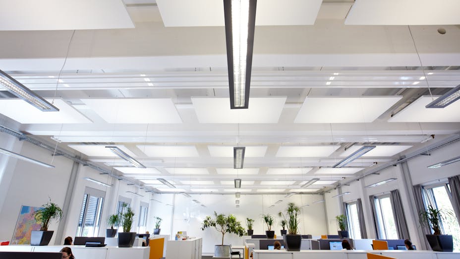 Rockfon acoustical ceiling tiles and panels installed in office space for productive environment.