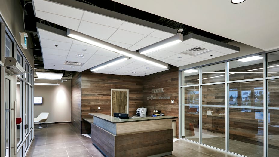 Rockfon Infinity ceiling edge extruded aluminum trim installed in head office lobby