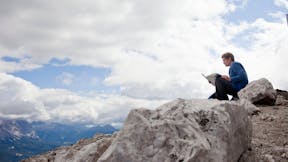 Man on mountain, rock, sitting